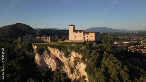 Sunlit Aerial View of Rocca di Angera Castle Over Historic Village