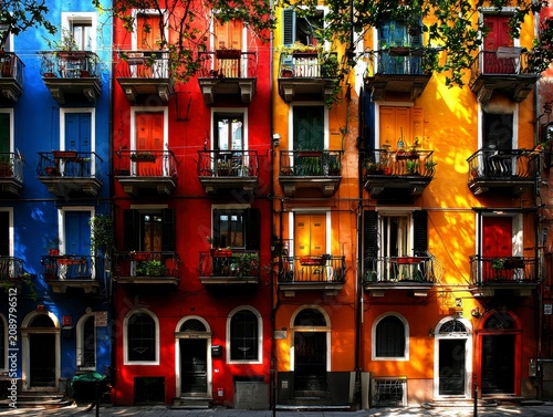 Striking Colorful Old Town Buildings with Balconies in Vibrant Sunlight