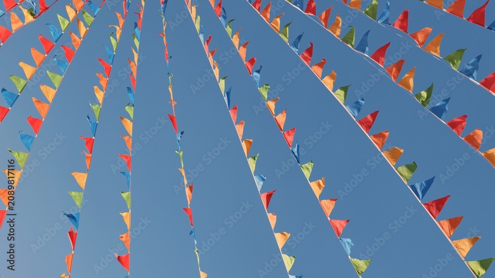 Fototapeta premium Colorful triangular flags waving in the wind in Moscow