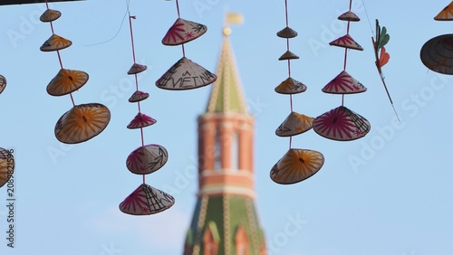 Photography Vietnamese conical hats hanging with Moscow Kremlin in background
