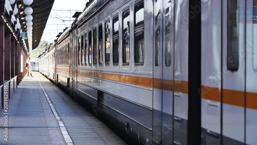 Photography Commuter train stopped at platform in a Moscow railway station, transport infras