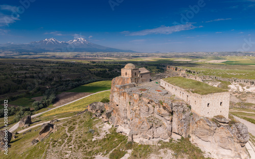 Aerial View of Yuksek Kilise in Guzelyurt Aksaray Turkey on Analipsis Hill with Byzantine Chapel and Cappadocia Landscape
