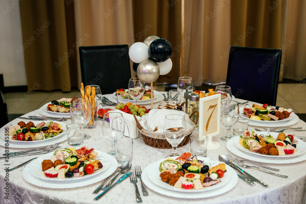 Fototapeta premium Elegant appetizers with gourmet toppings displayed on a white platter