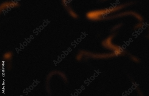 Canvas Print Abstract glow of ethereal orange trails on dark background