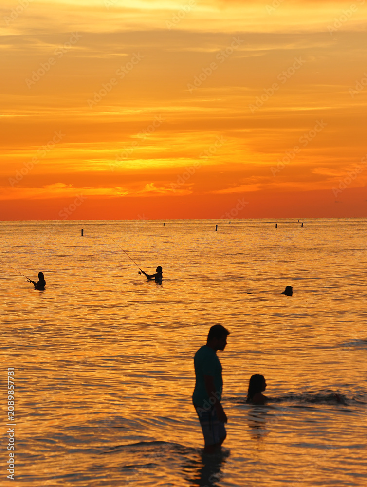 Fototapeta premium St Petersburg, Florida, USA: 07 03 2026: The landscape of saint Petersburg Madeira Beach in Florida at sun set at gulf of mexico