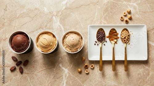Gourmet artisan ice cream flavors presented with exquisite toppings on a stylish marble countertop