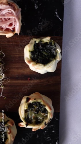 Top view of Gourmet Empanadas with Vegetable and Ham Cheese Filling on a wooden board