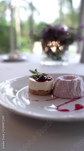 Raspberry Cheesecake with Ice Cream on Elegant Table
