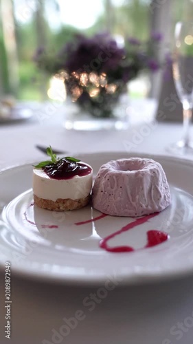 Raspberry Cheesecake with Ice Cream on Elegant Table