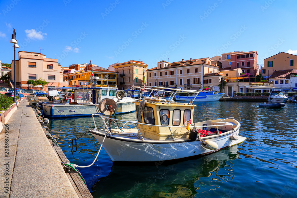 Obraz premium Fishing boat moored in Cala Gavetta in La Maddalena, capital city of the eponym archipelago located in the Mediterranean Sea in north-east of Sardinia, Italy