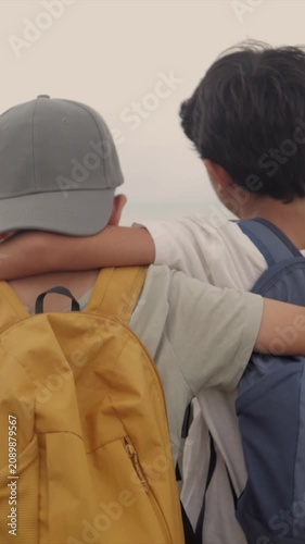 Two best friends embracing while walking together, sharing a moment of childhood camaraderie and support, representing true friendship, unity, and companionship outdoors