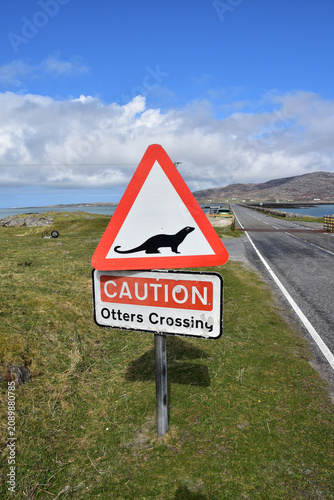 Unusual Otter Crossing Sign Posted Along Roadway in Outer Hebrides