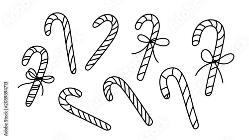 Hand drawn candy canes with bows on a white background