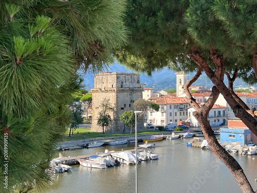 Viareggio panoramic view of historic part of city with medieval Torre Matilde and old marina docks on Burlamacca canal, Lucca, Tuscany, Italy.