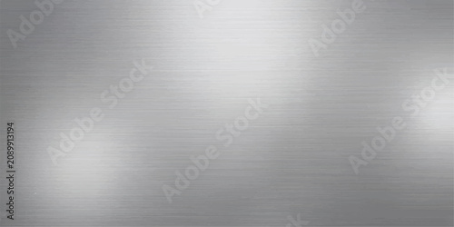 Abstract brushed metal texture background, soft gradient light and reflection effects creating a modern, sleek aesthetic.