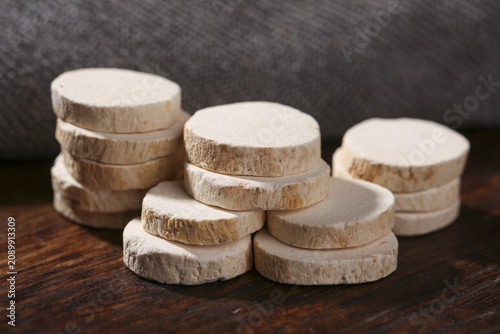 Fresh Sliced Yam Root Chips on Wooden Surface - Healthy Natural Vegetable Food Ingredient