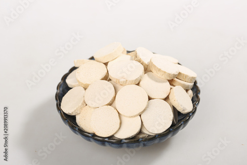 Traditional Chinese Dried Yam Slices in Bowl Studio Shot White Background