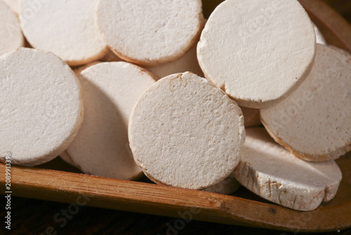 Traditional Chinese Yam Slices on Wooden Board - Fresh White Root Vegetable for Asian Cuisine