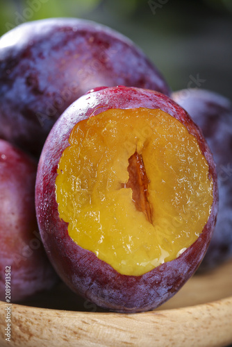 Fresh Cut Purple Plums with Golden Flesh Still Life Food Photography