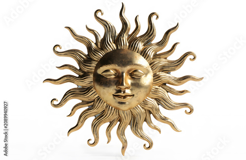 Ornate decorative gold sun symbol. Artistic decor and celestial design. A detailed metallic gold sun emblem with a human face isolated on white