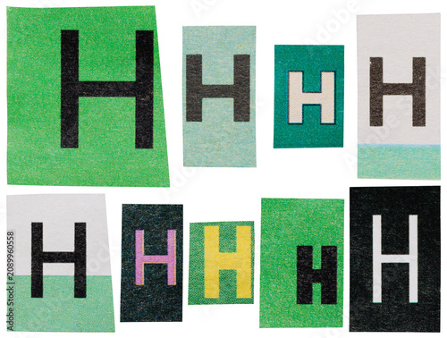 Green letter H made of mixed font newspaper clippings isolated ransom alphabet for scrapbooking