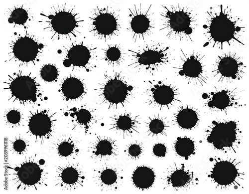 A collection of black ink splatters on a white background