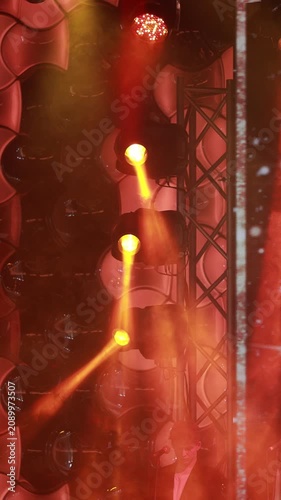 Spotlights in the concert hall. Stage light with colored spotlights and smoke.