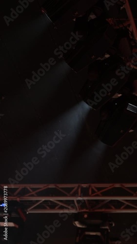 Spotlights in the concert hall. Stage light with colored spotlights and smoke.