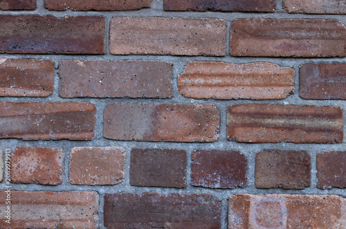Принти на полотні Background of new red bricks in a wall with grey mortar