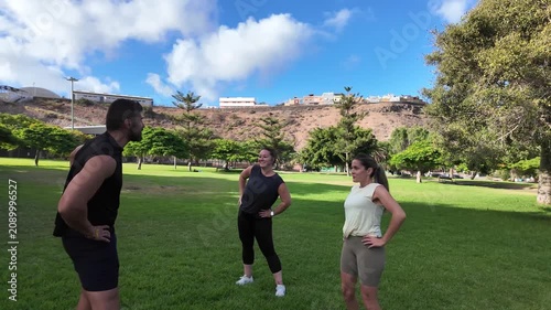 Women training in the park with their instructor