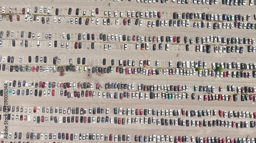 Aerial view of a car impound lot with damaged cars after an accident or towed for illegal parking.