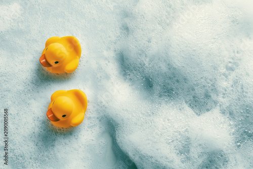 Two yellow rubber ducks in foam