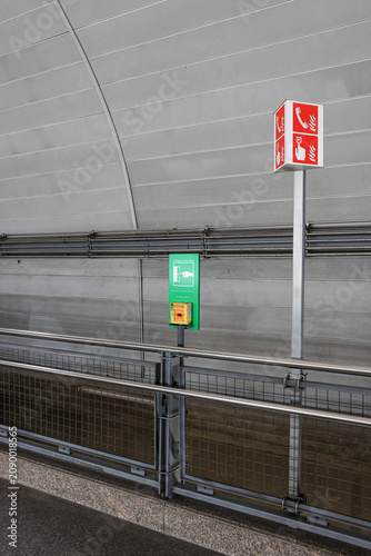 emergency equipment sign and Emergency contact equipment in modern train station.