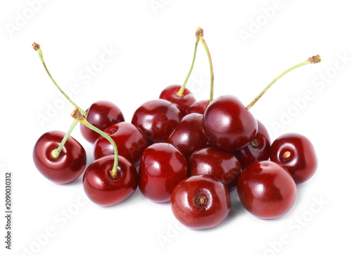 Many fresh ripe cherries isolated on white