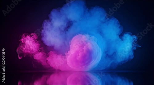 Vibrant pink and blue smoke bursts rise against a dark background with reflection