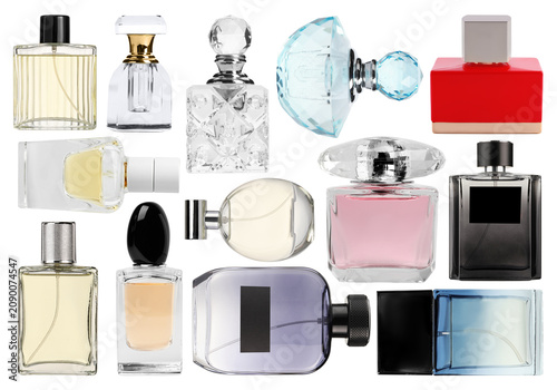 Foto Bottles of different perfumes on transparent background, set