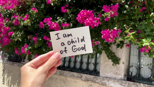 I am a child of God - christian text with pink flowers background, faith and encouragement