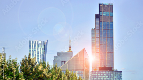 Building surrounded with green trees.  Eco-friendly building. Sustainable architecture of city reducing heat carbon dioxide modern city environment.