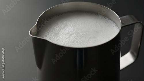 Close-up of milk in jug.