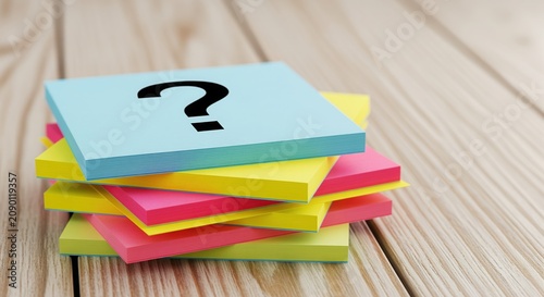 Colorful sticky notes in blue, yellow, and pink on a wooden surface. The top note shows a black question mark, symbolizing curiosity and problem-solving. Ideal for brainstorming concepts.