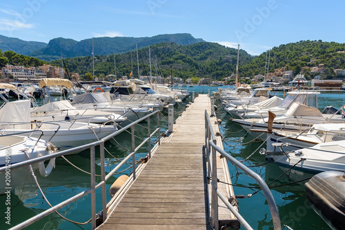 Boats moored at marina pier in Port de Soller on Mallorca