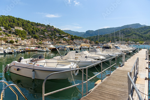 Boats moored at marina pier in Port de Soller on Mallorca