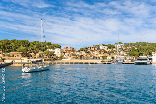 Port de Soller waterfront with Mediterranean buildings and turquoise bay, Mallorca