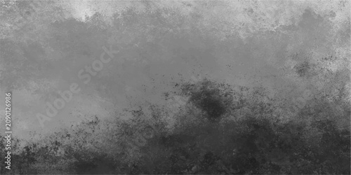 Tableau sur toile Abstract grunge textured background in shades of gray and black, with a dramatic, moody atmosphere suggestive of stormy skies or a dark, textured surface