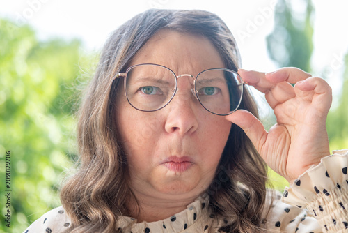 Принти на полотні close up portrait shocked mature woman with bulging eyes, surprised facial exagg