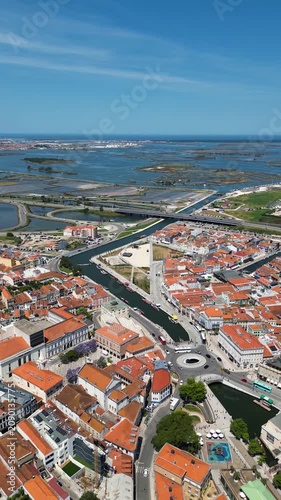 High altitude drone flyover of Aveiro city, main river and local boats