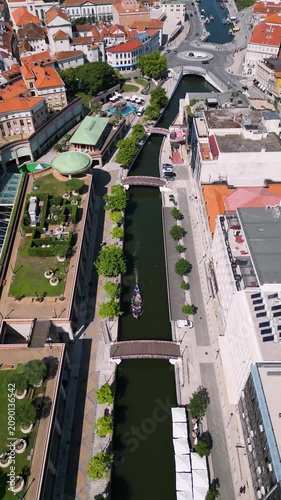 Beautiful drone view of Aveiro city waterfront, flowing river and boats