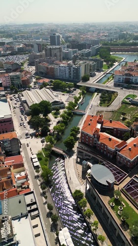 Daytime drone exploration of Aveiro city, picturesque river and traditional boats