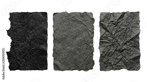 Three textured crumpled black paper sheets isolated.