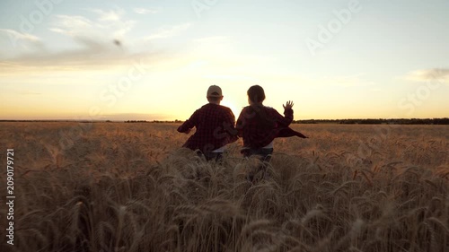 child play wheat field, two child kid teenagers schoolchildren run through rural fields sunset, nature summer sunset, children play superheroes, tag game, happy childhood family, childhood dream boy